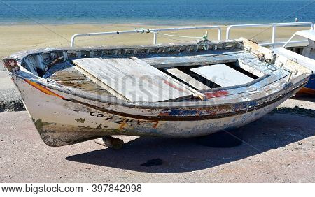 Portosin, Spain. September 11, 2020. Old Galician Wooden Rowboat In A Harbor. Coruña Province, Rias 