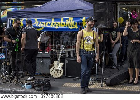 Sao Paulo / Sao Paulo / Brazil - 08 19 2018: Man With Suspensories And Jeans Walking Near A Rock Eve