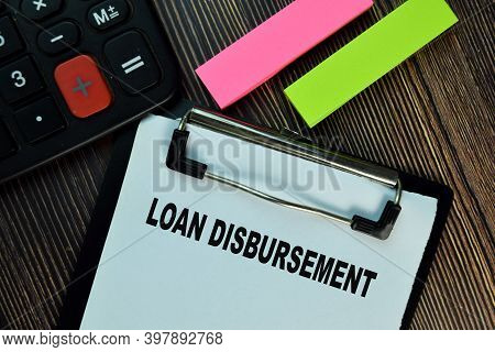 Loan Disbursement Write On A Paperwork Isolated On Wooden Table. Finance Concepts