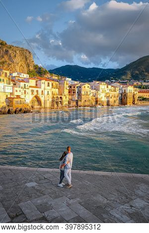 Cefalu, The Medieval Village Of Sicily Island, Province Of Palermo, Italy. Europe, A Couple On Vacat