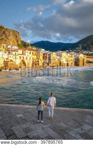 Cefalu, The Medieval Village Of Sicily Island, Province Of Palermo, Italy. Europe, A Couple On Vacat