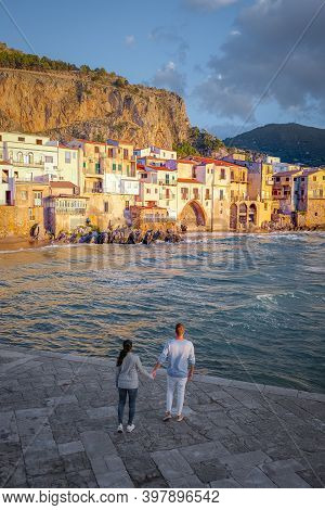 Cefalu, The Medieval Village Of Sicily Island, Province Of Palermo, Italy. Europe, A Couple On Vacat