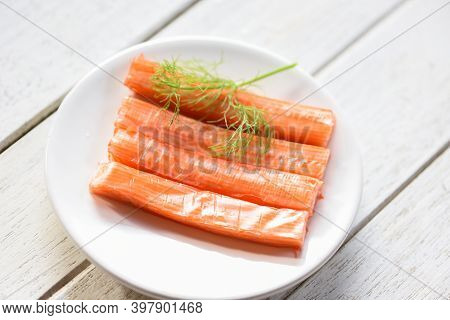 Crab Sticks On White Plate And Vegetable , Fresh Crab Sticks Surimi Ready To Eat Japanese Food