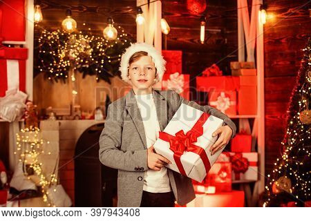Teen Boy Help Santa With Presents. Visit Santaland This Holiday. Winter Wonderland In North Pole. Sm