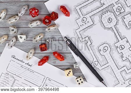 Top View Of Red Tabletop Role Playing Rpg Game Dices On Blurry Hand Drawn Dungeon Map And Character 
