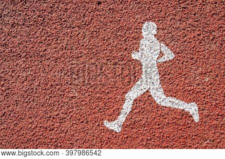 White Treadmill Symbol On Orange Asphalt For Running, Walking Or Jogging. Running Area In The Park. 