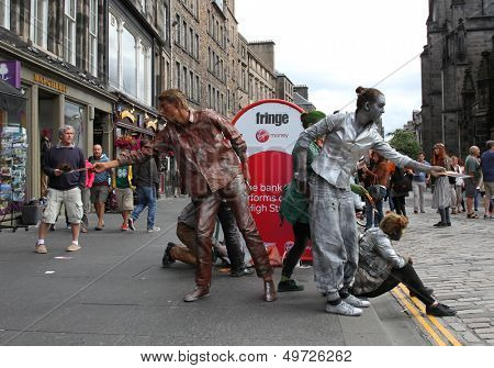 EDINBURGH- AUGUST 10: Members of Babolin Theatre publicize their show Sentinels during Edinburgh Fringe Festival on August 10, 2013 in Edinburgh, Scotland