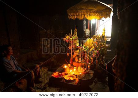 SIEM REAP, CAMBODIA - DEC 13: Sacrificial altar in the ancient ruins of Ta Prohm at the Angkor Wat, Dec 13, 2012 in Siem Reap, Cambodia. Angkor Wat is the country's prime attraction for visitors.