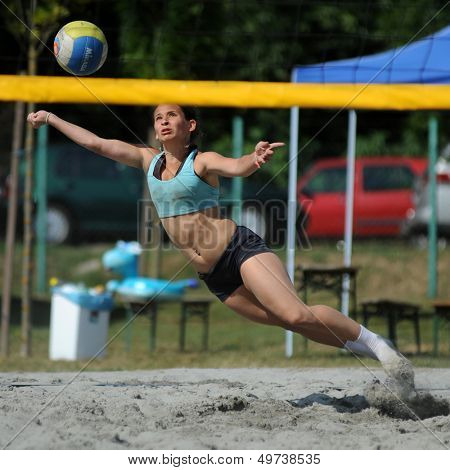 KAPOSVAR, HUNGARY - AUGUST 4: Kinga Fath in action at a ROAK Viragfurdo Kupa beach volleyball competition, August 4, 2013 in Kaposvar, Hungary.