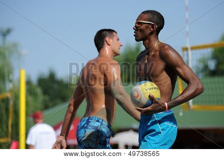 KAPOSVAR, HUNGARY - AUGUST 4: Leonel Munder (R) in action at a ROAK Viragfurdo Kupa beach volleyball competition, August 4, 2013 in Kaposvar, Hungary.