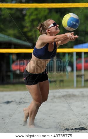 KAPOSVAR, HUNGARY - AUGUST 4: Klaudia Horvath in action at a ROAK Viragfurdo Kupa beach volleyball competition, August 4, 2013 in Kaposvar, Hungary.