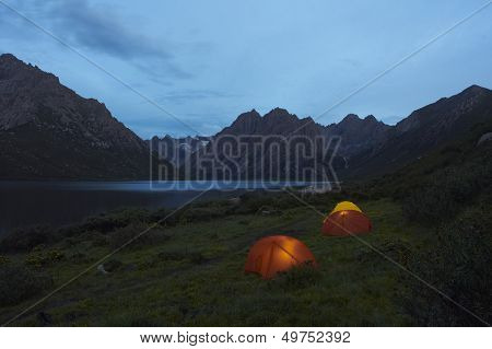 Lit Tents On Lakeshore
