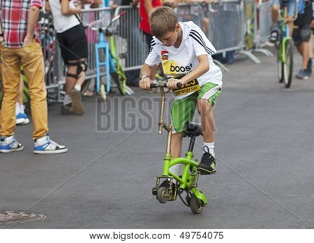 Kid On Strange Bicycle