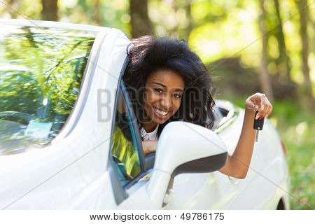 Young Black Teenage Driver Holding Car Keys Driving Her New Car