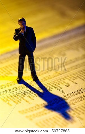 a small figure and the prices of shares in a newspaper. making money in the stock market. gains and losses in stock trading.