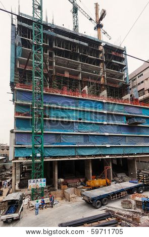BANGKOK, THAILAND - JANUARY 11, 2012: Workers on  construction site. Bangkok is on of the world's fastest growing megacities.