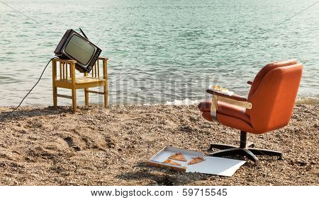 vintage decor on the lake shore, armchair and television