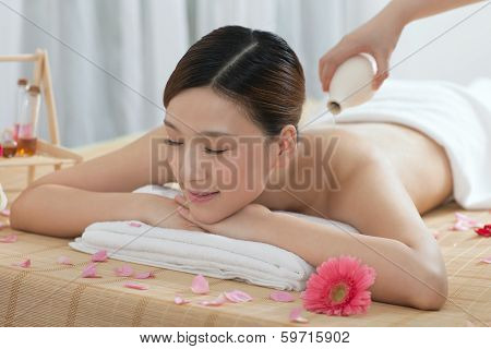.a Young Woman Enjoying Massage.