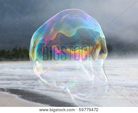 Man Making Large Soap Bubbles On Beach