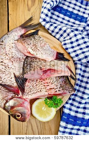 Bream Raw On Board With A Knife And Napkin