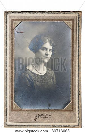 USA- CIRCA 1900s: An antique photo shows studio portrait of a young woman. 