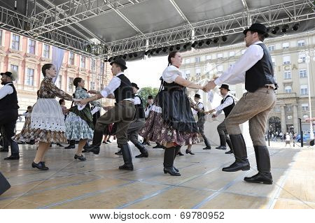 ZAGREB, CROATIA - JULY 19: Members of folk groups Nograd  from Salgotarjan, Hungary during the 48th International Folklore Festival in center of Zagreb, Croatia on July 19, 2014
