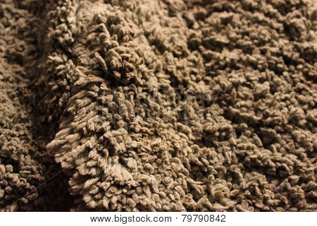 Grey door mat with a fold, texture