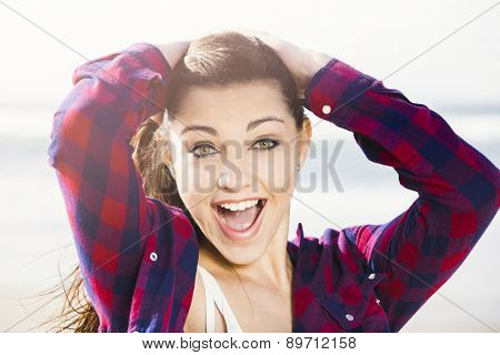Portrtait of a happy girl at the beach smilling 