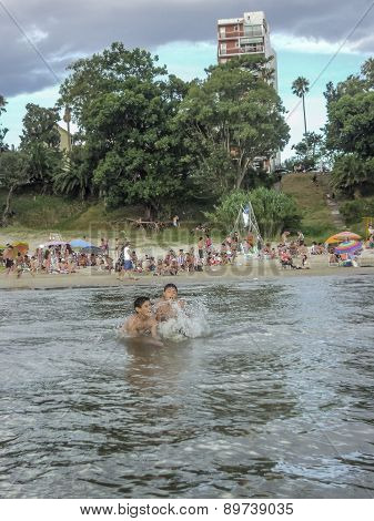 Children Playing In The Water