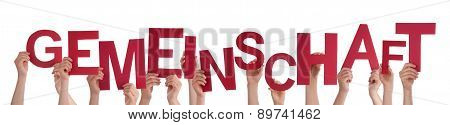 People Holding Word Gemeinschaft Means Community