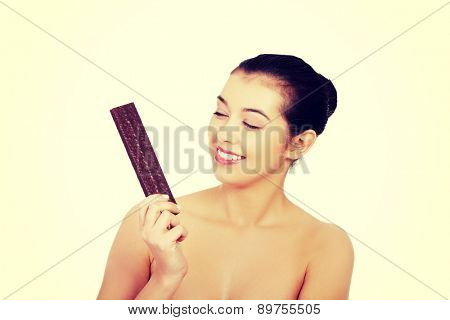 Beautiful woman holding a waffer