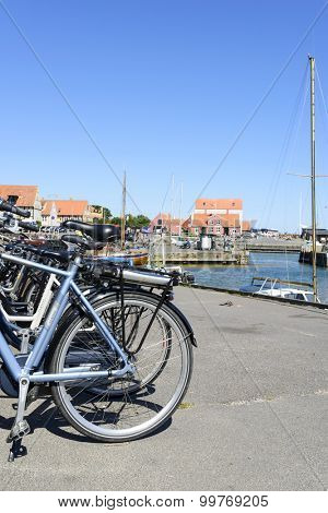 SVANEKE - AUGUST 14 Bicycles are waiting for tourists along the quay at the port on 14 August 2015 in Svaneke on Bornholm Island, Denmark.