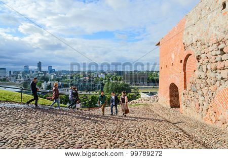 Tourists Climb On Gediminas Mountain On Rocky Road