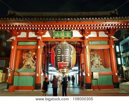 Tourists visit Kaminarimon - entrance gate of Senso-ji Temple in Asakusa, Tokyo, Japan.