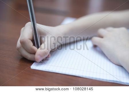 Boy's Hand With A Pencil
