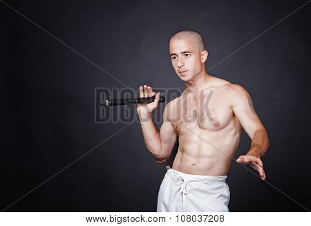 Man with nunchak