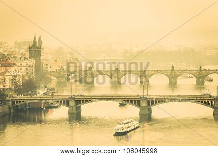 View Of Charles Bridge In Prague And Vltava River From Letna Hill - Warm Desaturated Filtered Look