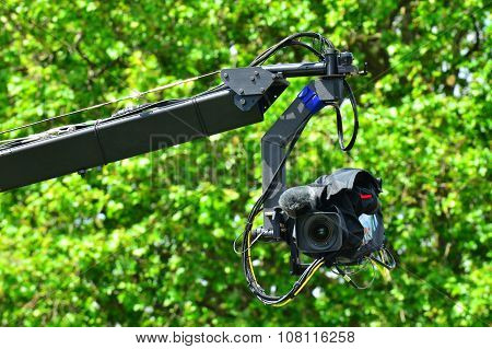 Professional video camera on JIb crane outdoors.