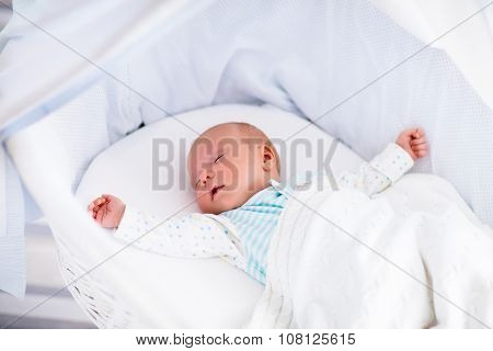 Cute Newborn Baby In White Bed