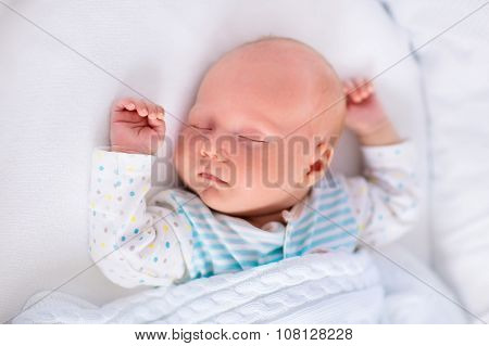 Cute Newborn Baby In White Bed