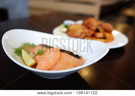 Dish of Japanese rice, topped with Salmon and shrimp eggs sauce