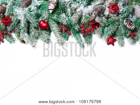 Christmas Border. Tree branches with baubles, stars, snowflakes isolated on white