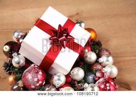 New Year gift on a golden tinsel background boly
