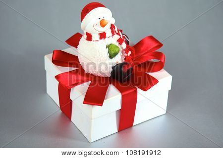 New Year gift on a golden tinsel background boly
