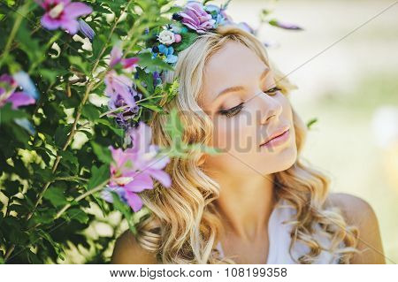 Photo of beautiful young girl in spring garden