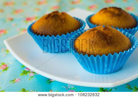 Muffins On Blue Background