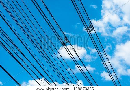 High Voltage Transmission Lines On Blue Sky