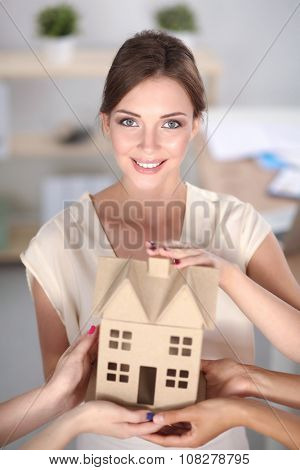 Business People& Hand Holding Eco  House 