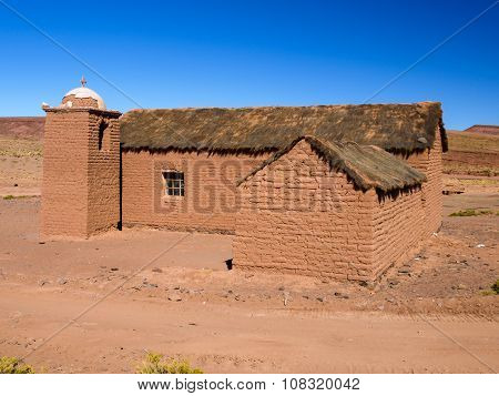 Small rural andean style church made of unfired clay bricks