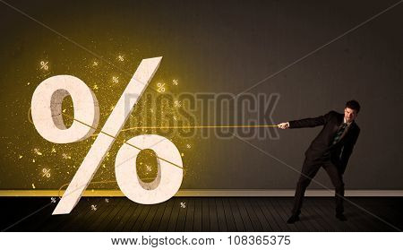 Business man pulling rope with big procent symbol sign concept on background